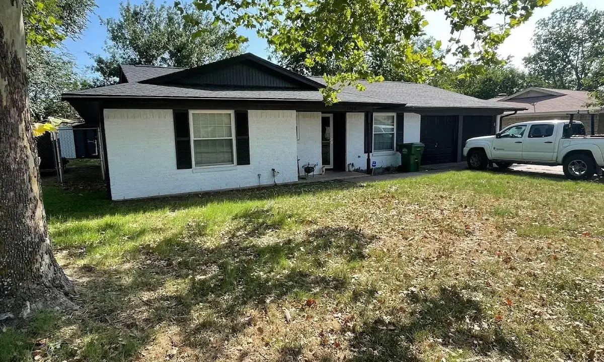 Professional roofing crew working on a residential roof in CaÃ±on City